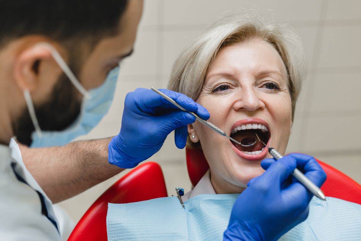 Woman undergoing Gum Disease Treatment in Hewlett, NY